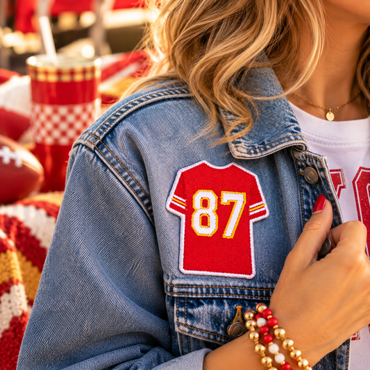 87 jersey iron-on patch in Chiefs colors on denim jacket