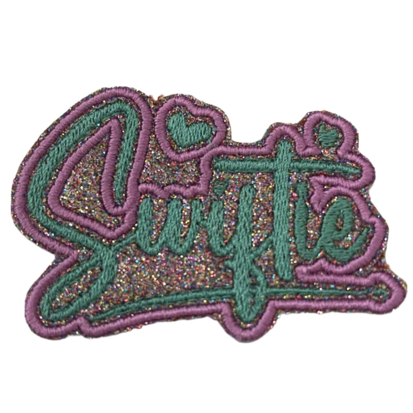 Handmade Glitter "Swiftie" Iron-On Patch with vibrant script and heart accents, perfect for accessories.