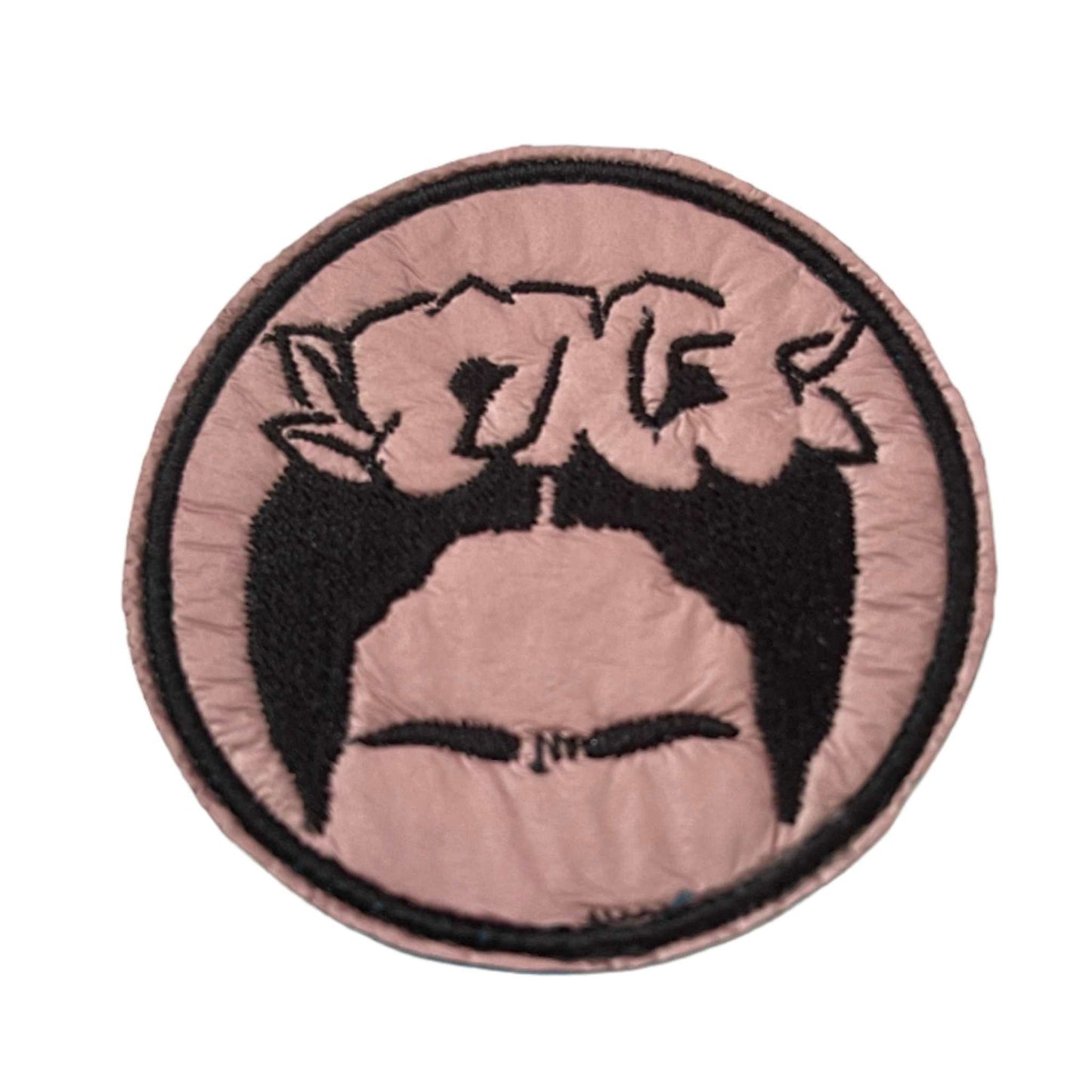 Handmade Frida Kahlo iron-on patch, black and pink illustration with artistic design.