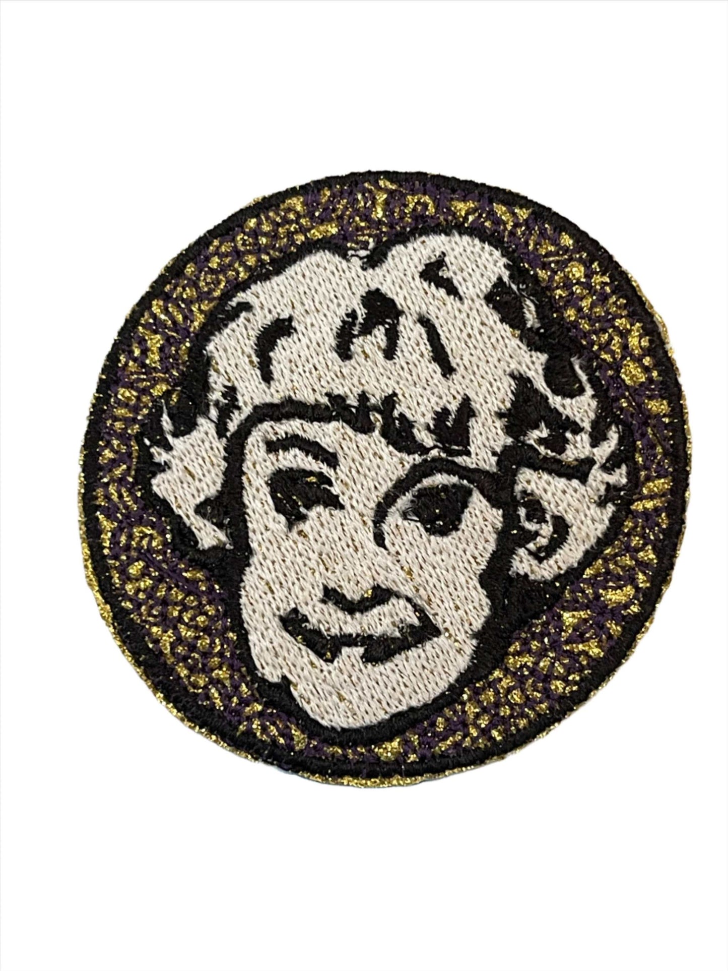 Handmade Dorothy Golden Girls iron-on patch with sparkle gold background and black embroidery.