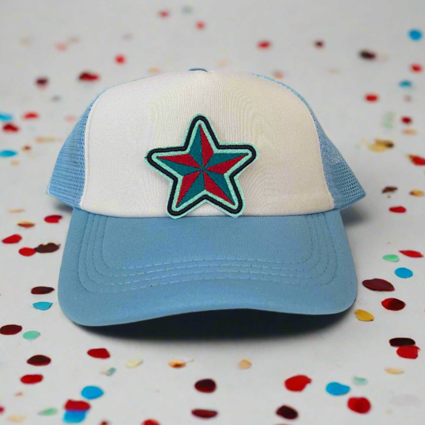 Close-up of a star embroidered patch in Kansas City Current team colors, perfect for customizing hats and other accessories.