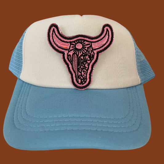 Close-up of a Western Bull Skull embroidered patch with pink and black detailing, perfect for customizing hats and other accessories.