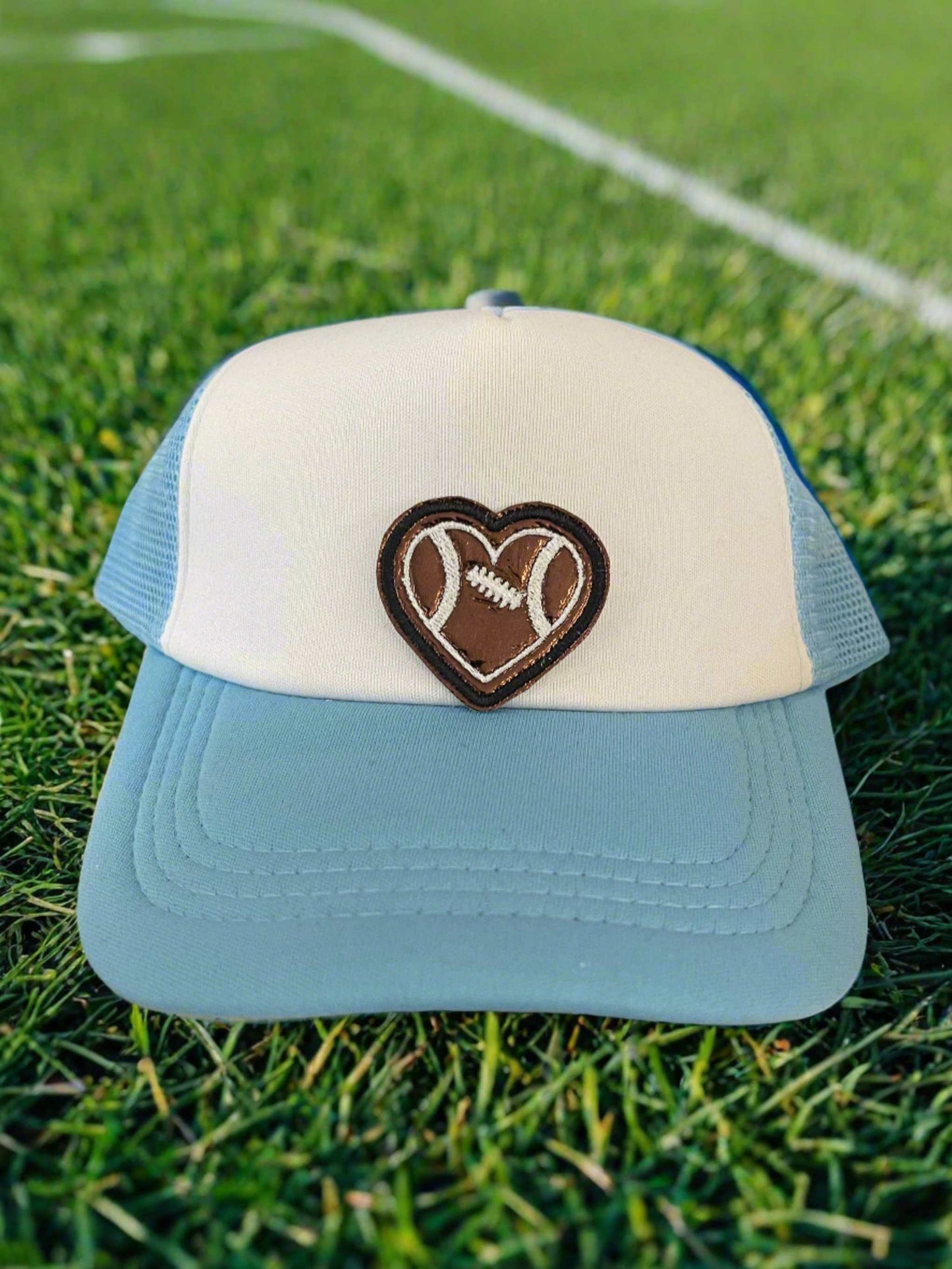 Heart-shaped football patch in brown and white, ideal for adding a sporty and loving touch to your gear.