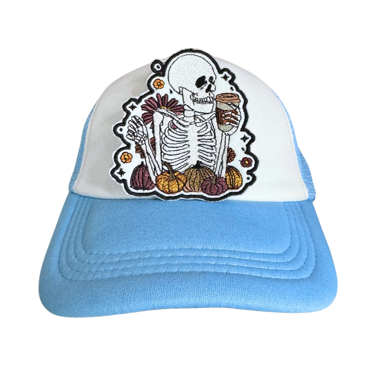 Skeleton patch with a fall theme, featuring a skeleton holding a pumpkin spice latte, surrounded by pumpkins and autumn flowers.