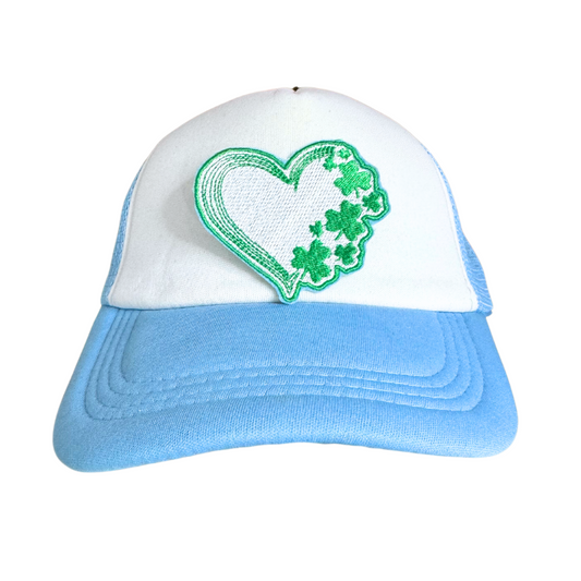 Heart-shaped patch with shamrock design in green and white.
