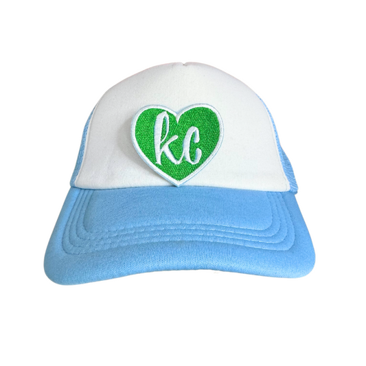 Green heart patch with white "KC" lettering.
