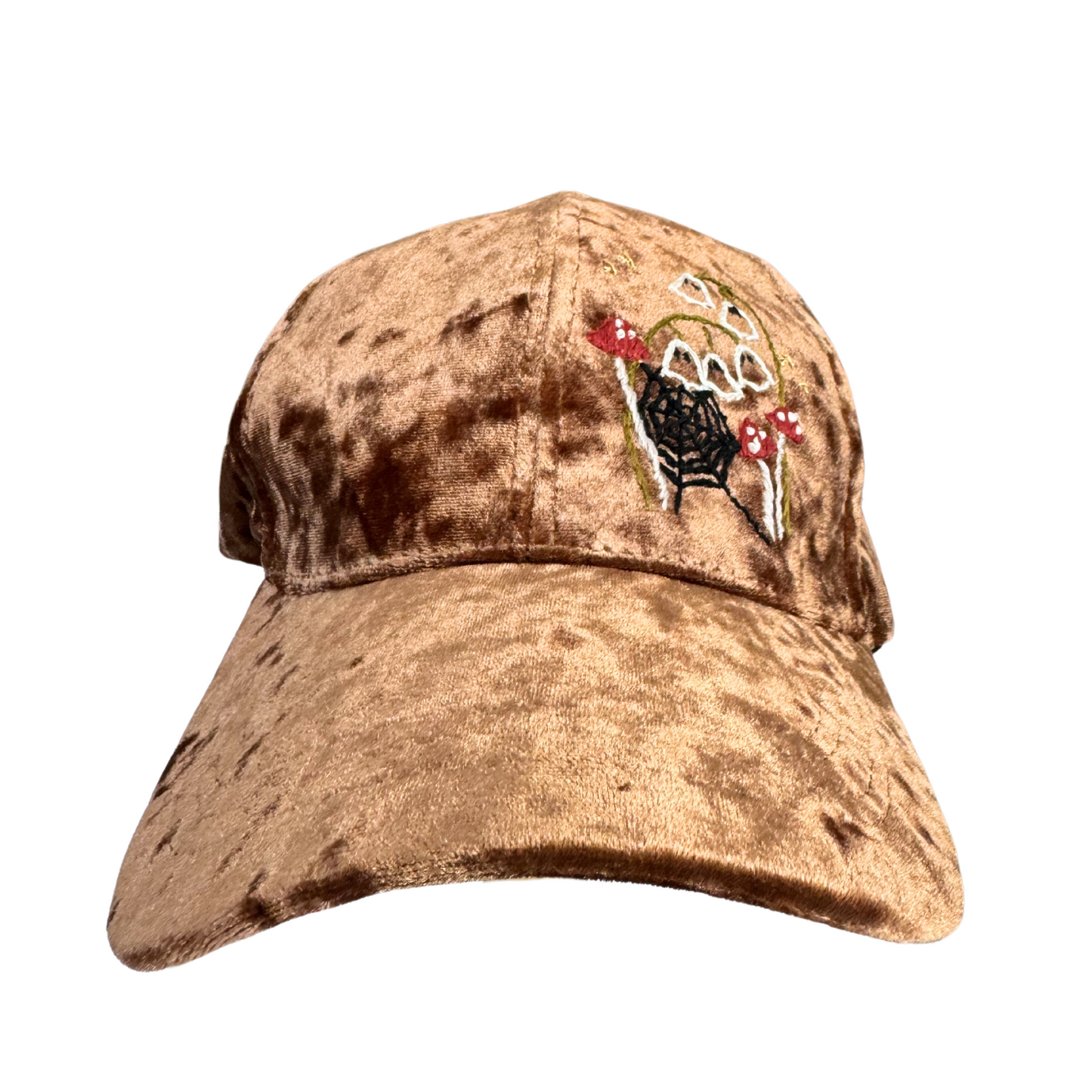 Brown velvet hat with hand-embroidered mushroom and spider web design.