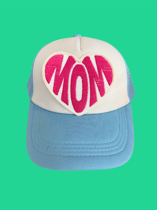 Custom embroidered patch with the text "MOM" in a heart shape, designed for personalization on hats and apparel.