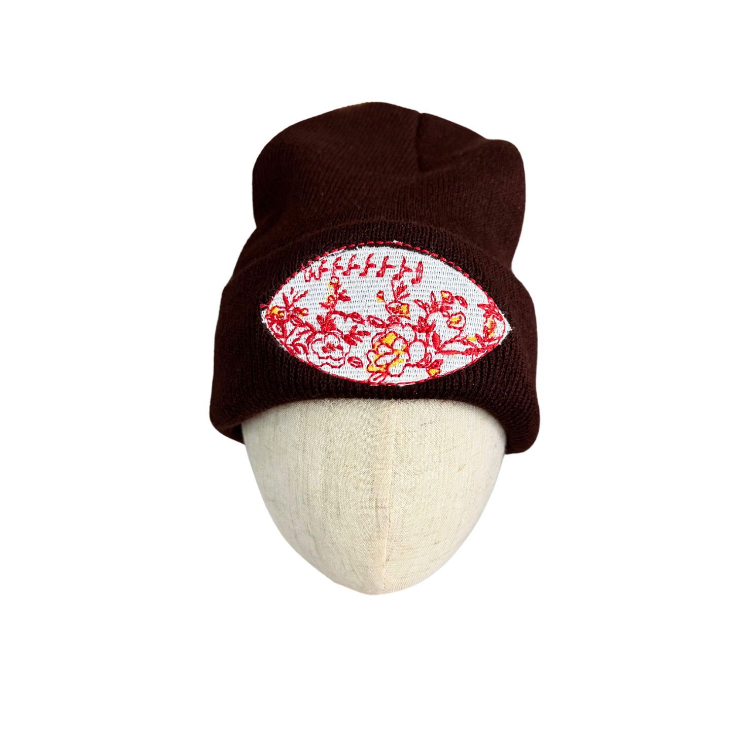Brown beanie with red and yellow chinoiserie football patch, Kansas City Chiefs colors.