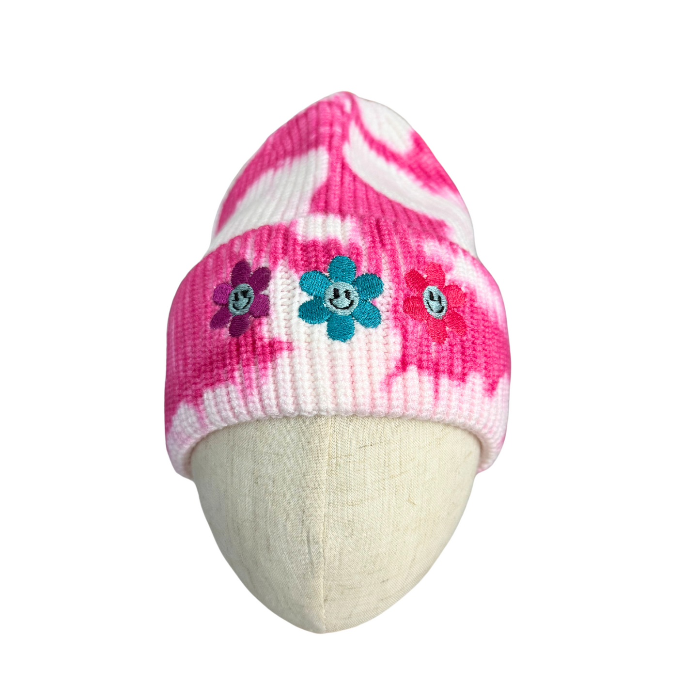 Adult pink tie-dye beanie with embroidered smiley flowers, cozy snug fit.