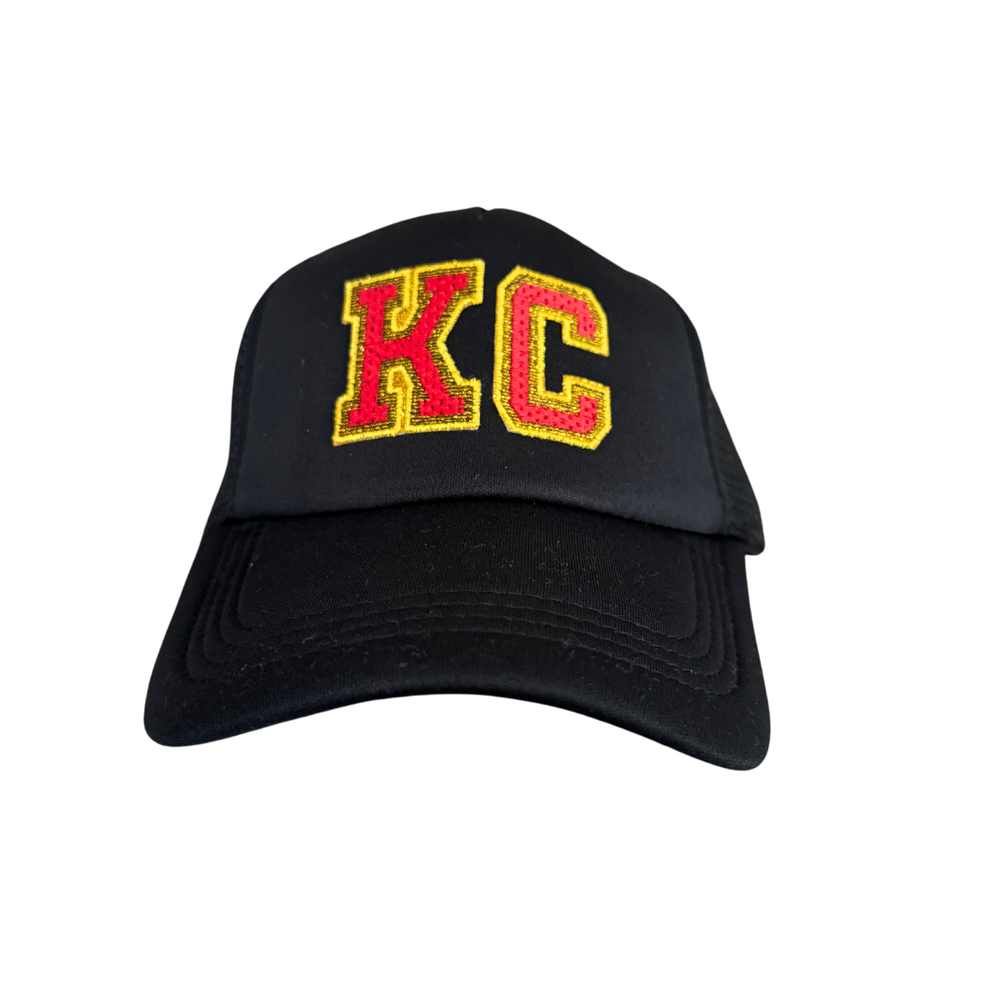 Black trucker hat with "KC" embroidered patch in Chiefs colors, handmade in Kansas City.