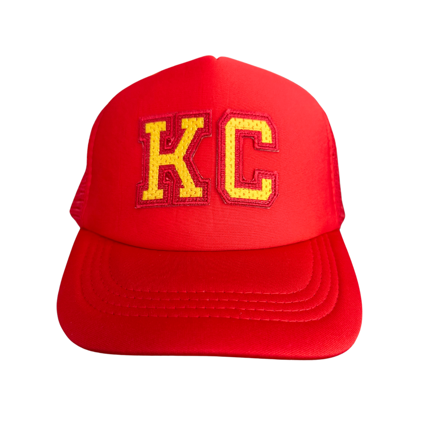 Kansas City "KC" red trucker hat with embroidered patch in Chiefs colors.