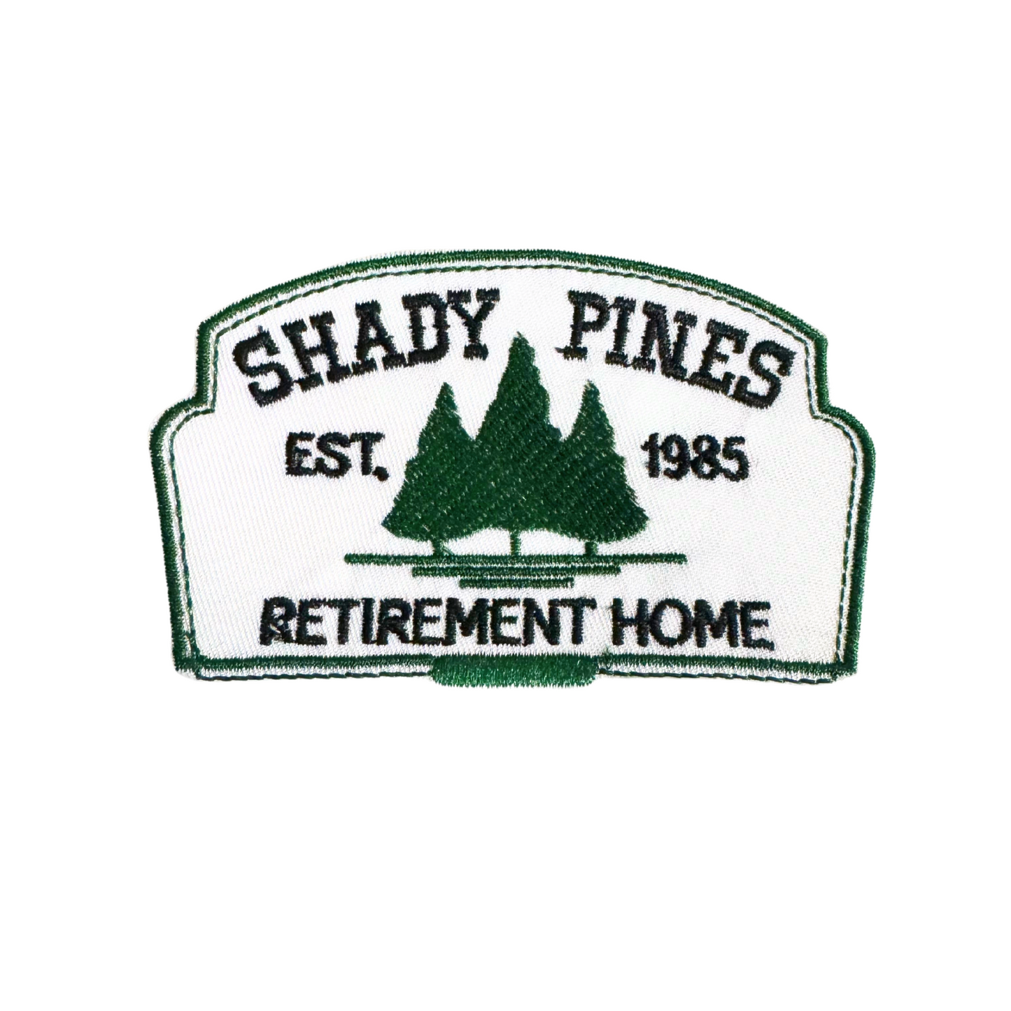 "Shady Pines Retirement Home" iron-on patch with forest green embroidery on white background, inspired by The Golden Girls.