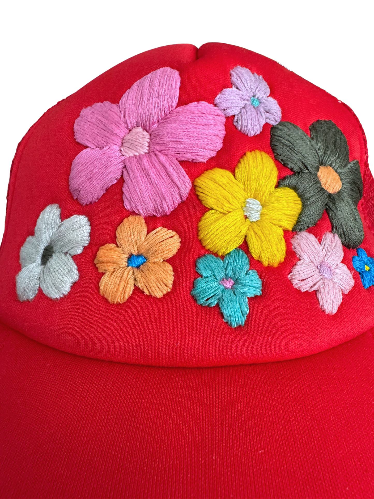 Hand-embroidered colorful flowers on red hat.