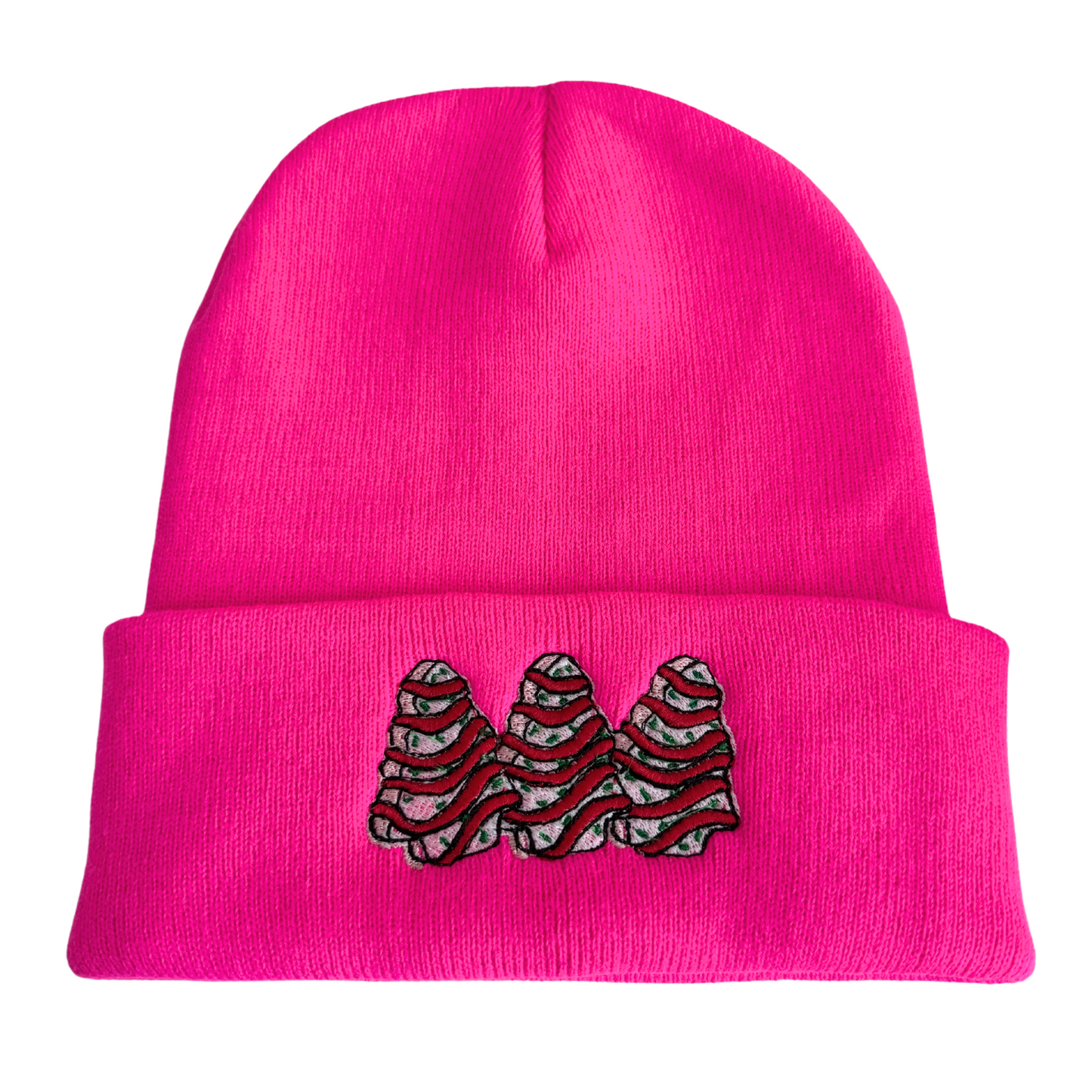 Bright pink beanie with embroidered Christmas tree snack cake design