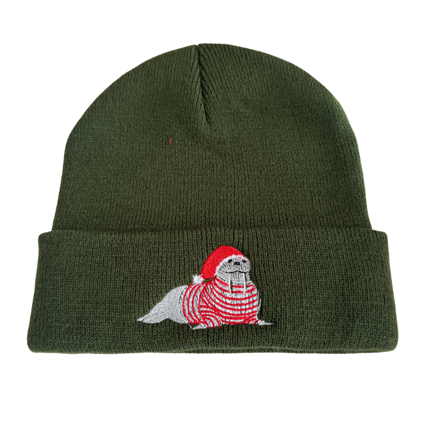 Olive green beanie with festive embroidered walrus in a Santa hat and red striped sweater.