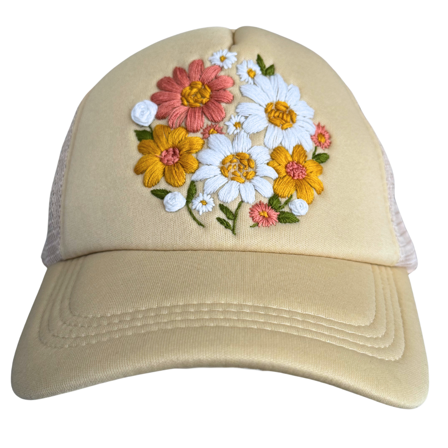 Cream floral bouquet hat with hand-embroidered flowers in white, pink, and yellow, made in Kansas City.