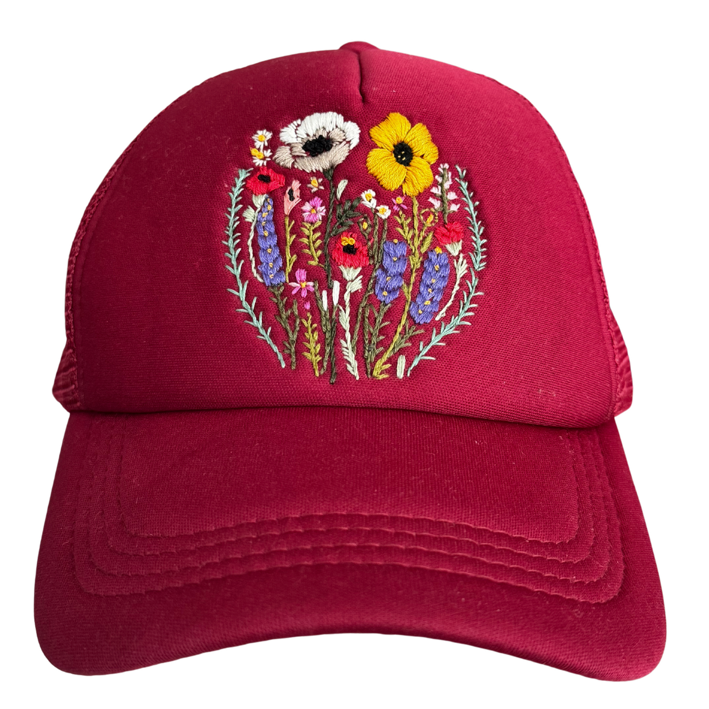 Red wildflower embroidered trucker hat with hand-stitched floral design.