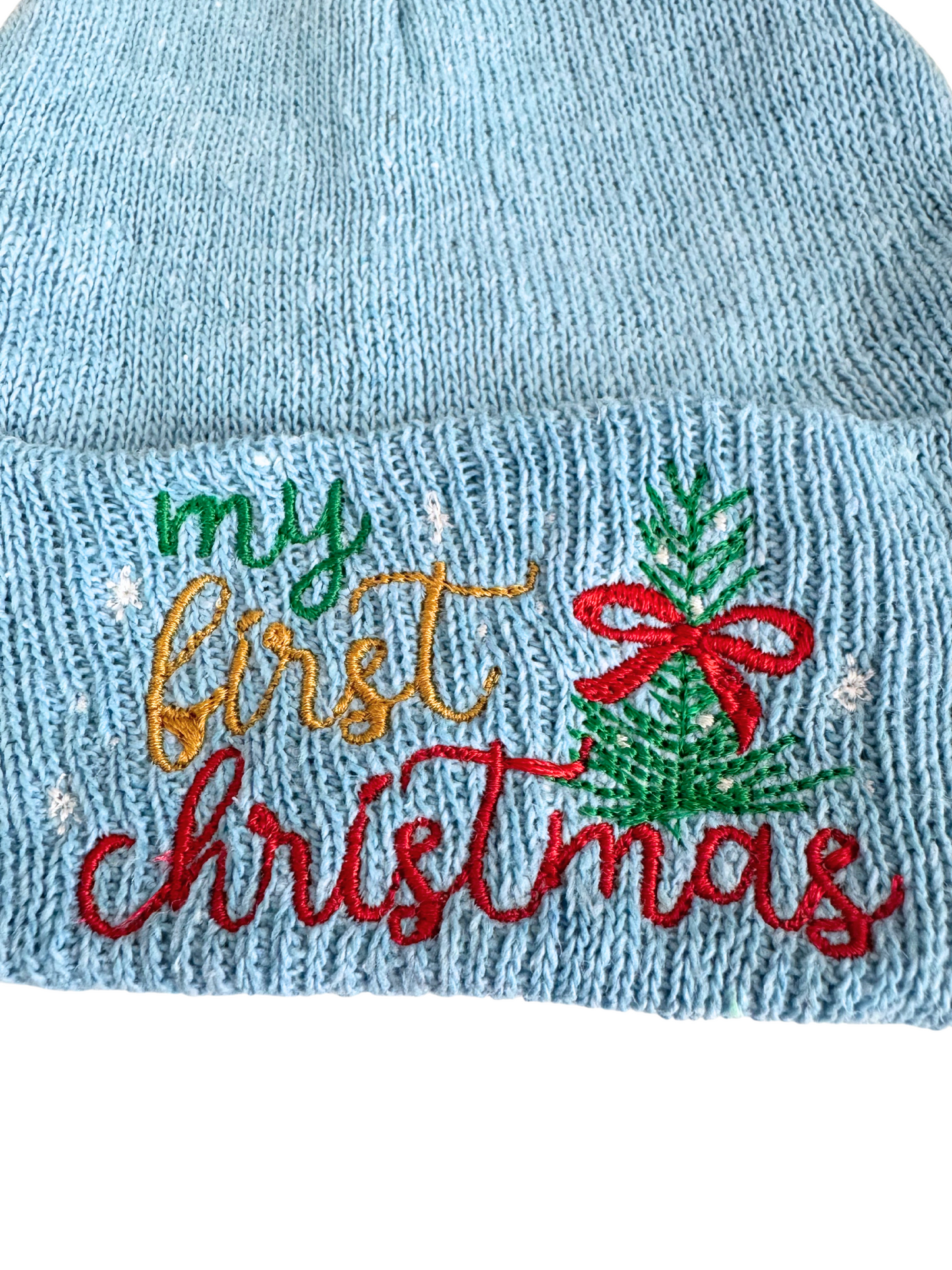 Light blue baby beanie with "my first Christmas" embroidered text and a festive tree design.