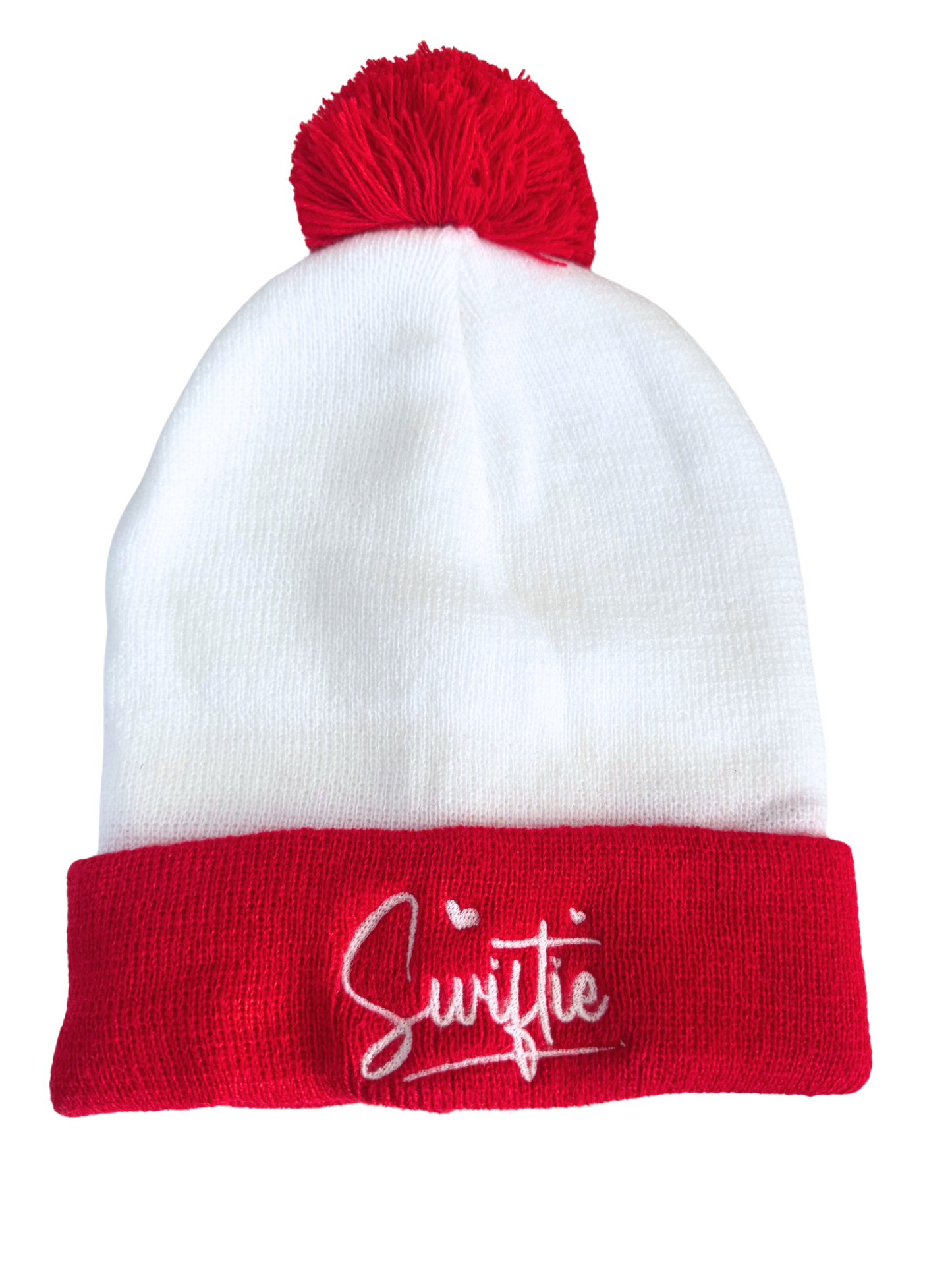 Red and white beanie with a red pom, featuring "Swiftie" embroidered in white.