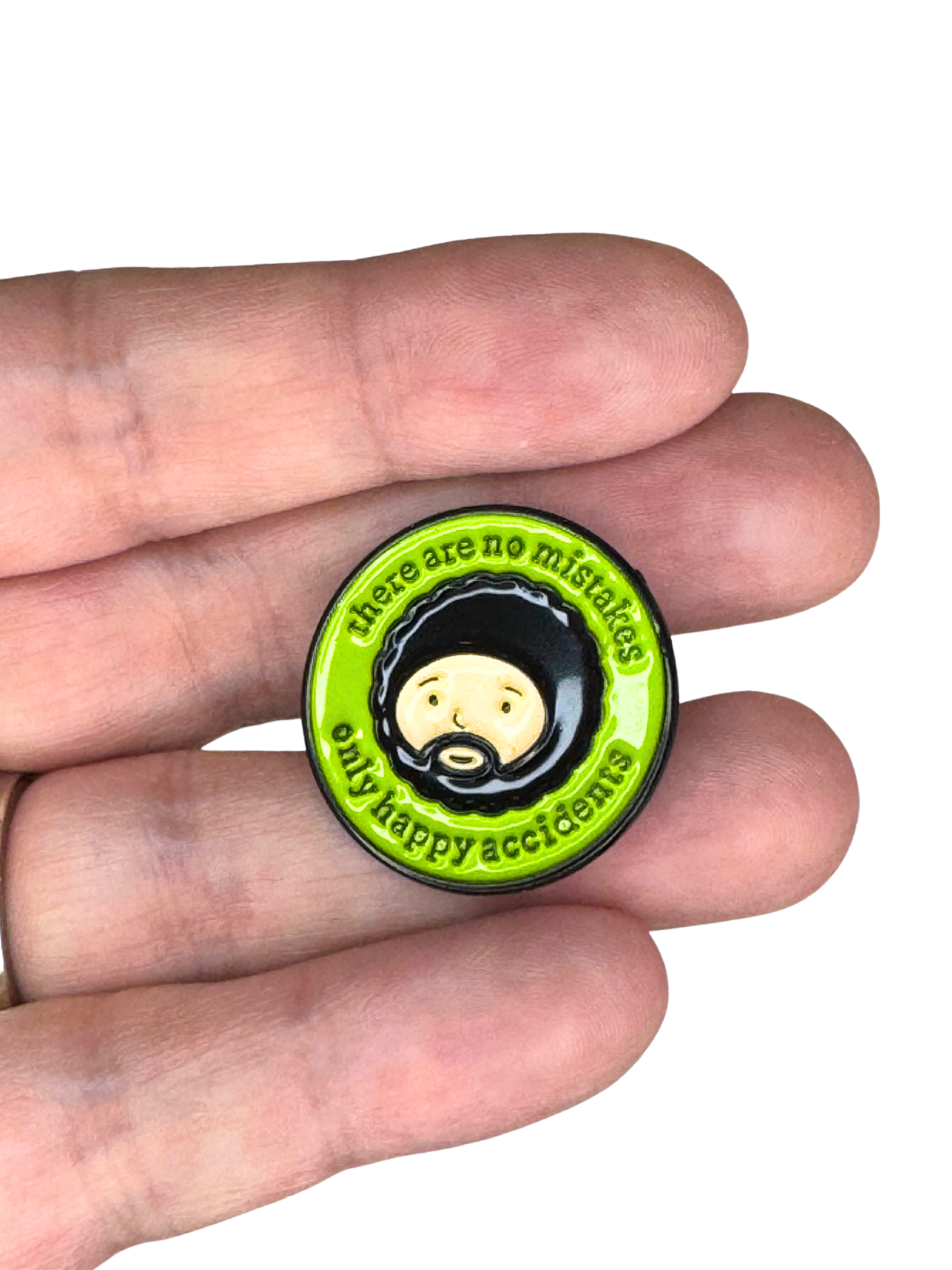 Hand holding Afro Painter pin for scale