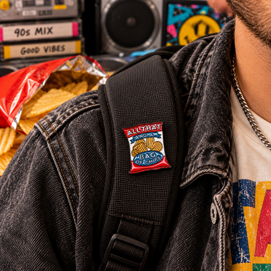 All That and a Bag of Chips enamel pin on backpack strap 90s lifestyle image