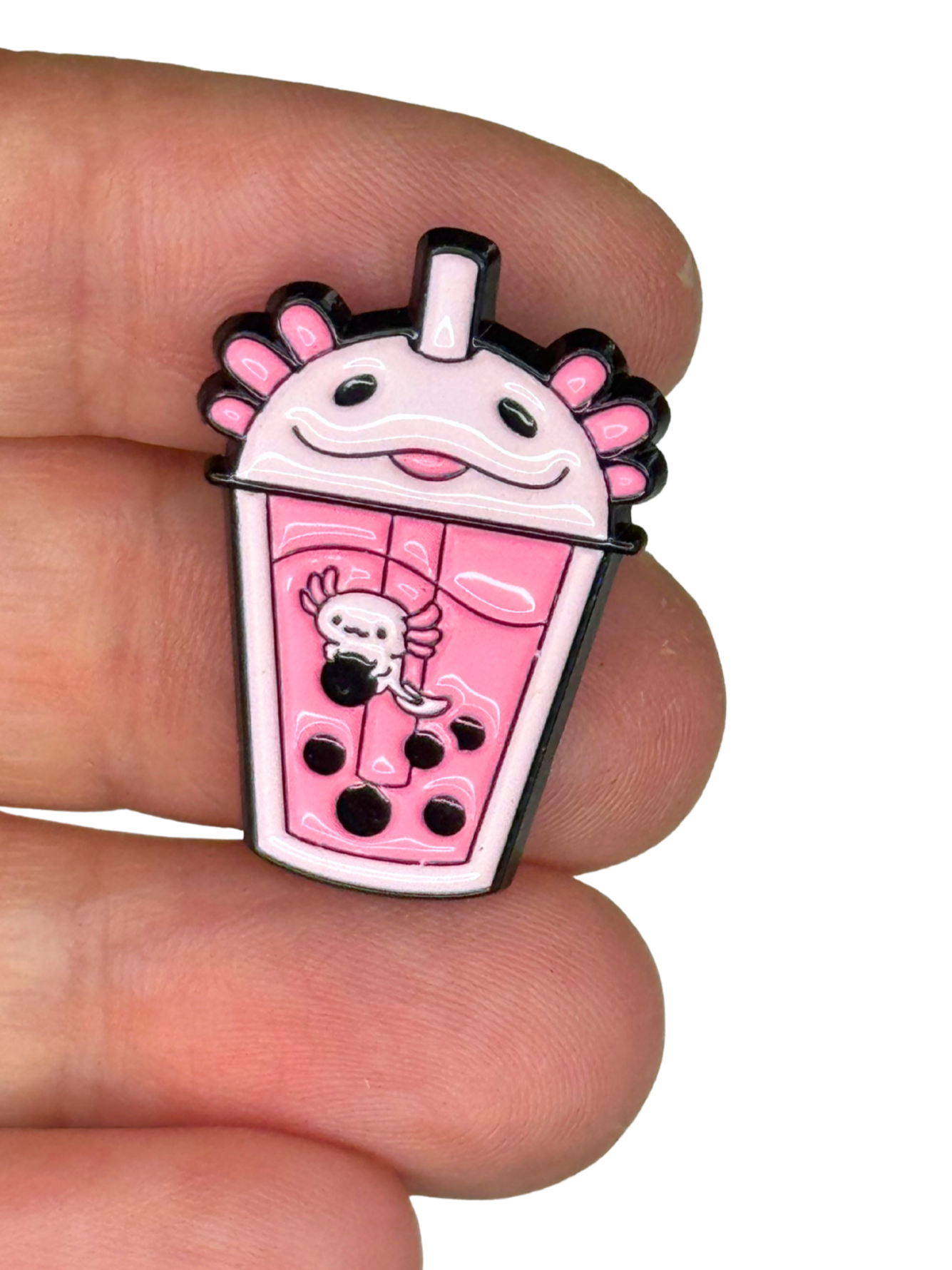 “Pin size shown on fingers for scale”