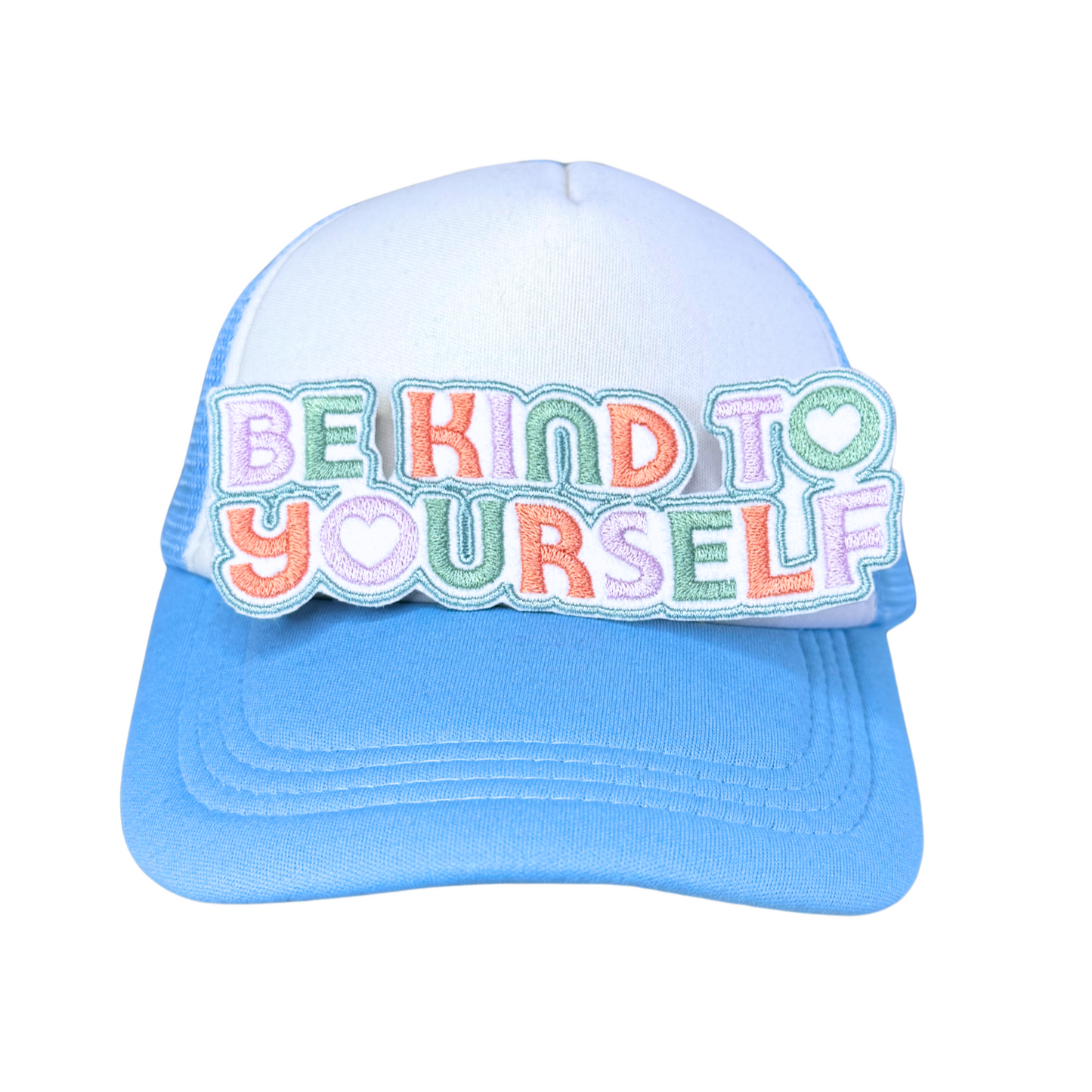 "Be Kind to Yourself" embroidered patch attached to a light blue and white trucker hat.