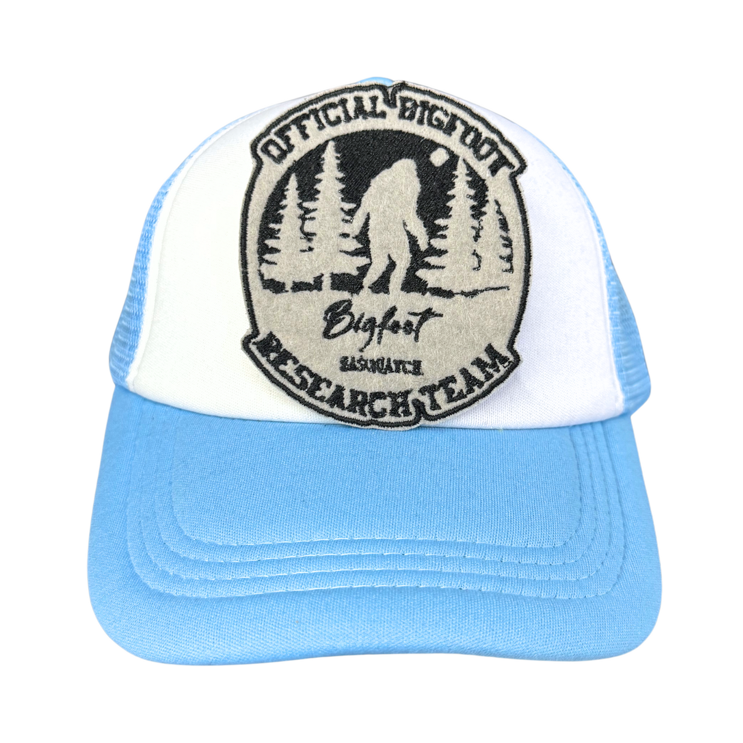 "Official Bigfoot Research Team" embroidered patch attached to a light blue and white trucker hat.