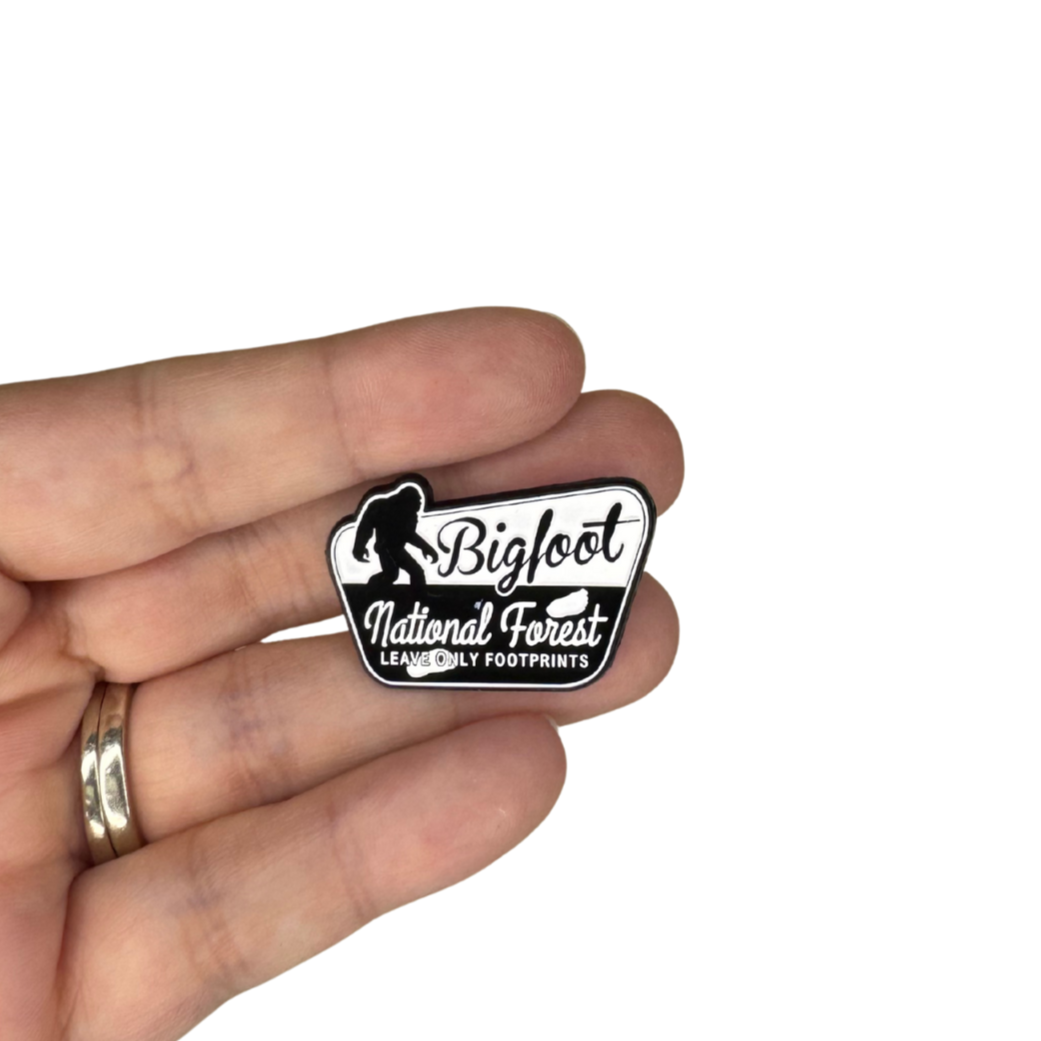 Person holding the Bigfoot pin showing size