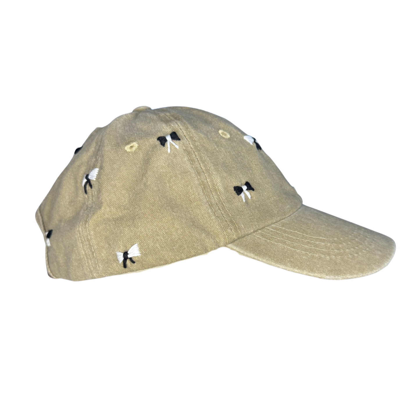 Beige cap with black studs on a white background