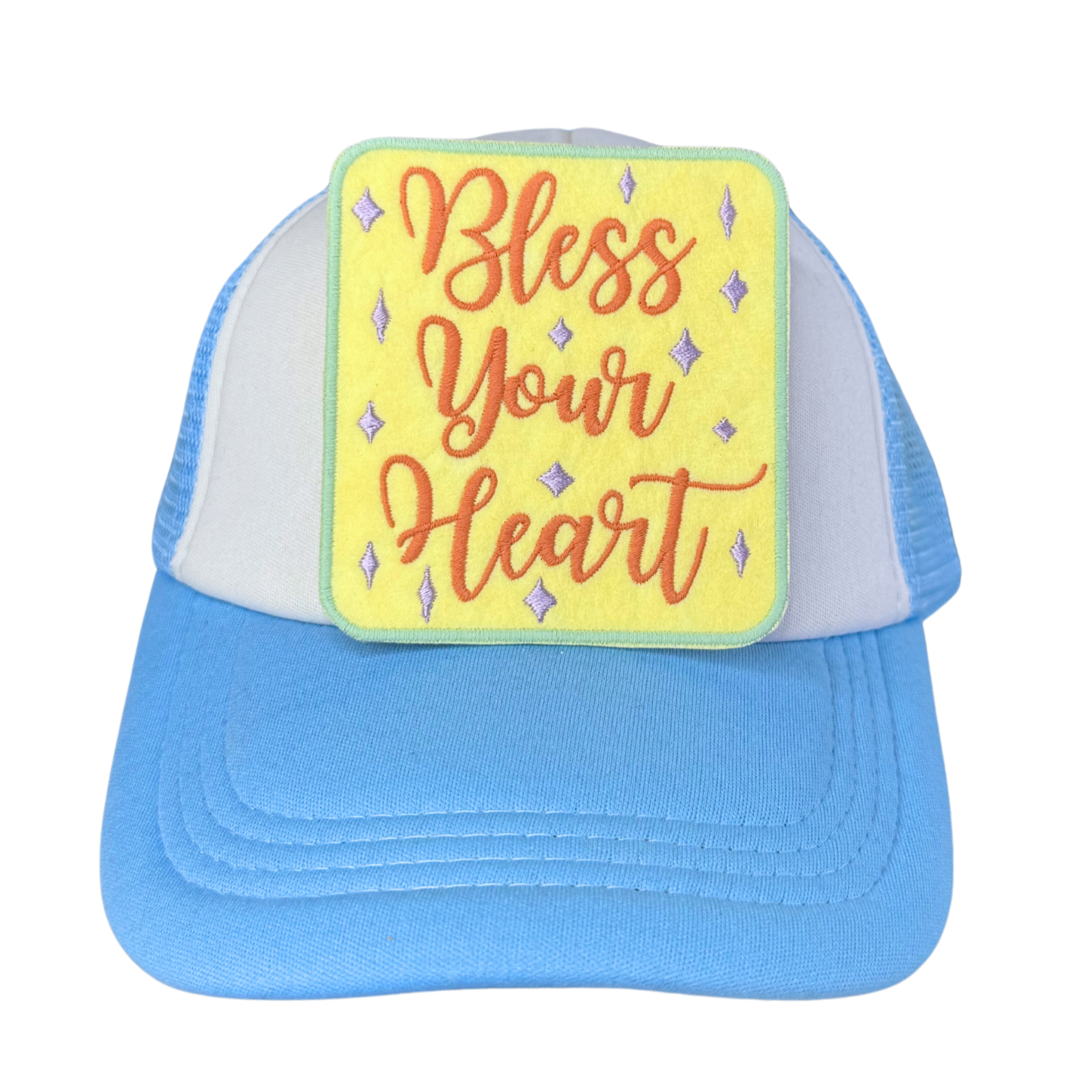 "Blue and white trucker hat featuring an embroidered 'Bless Your Heart' patch in Southern-style script with a yellow background."