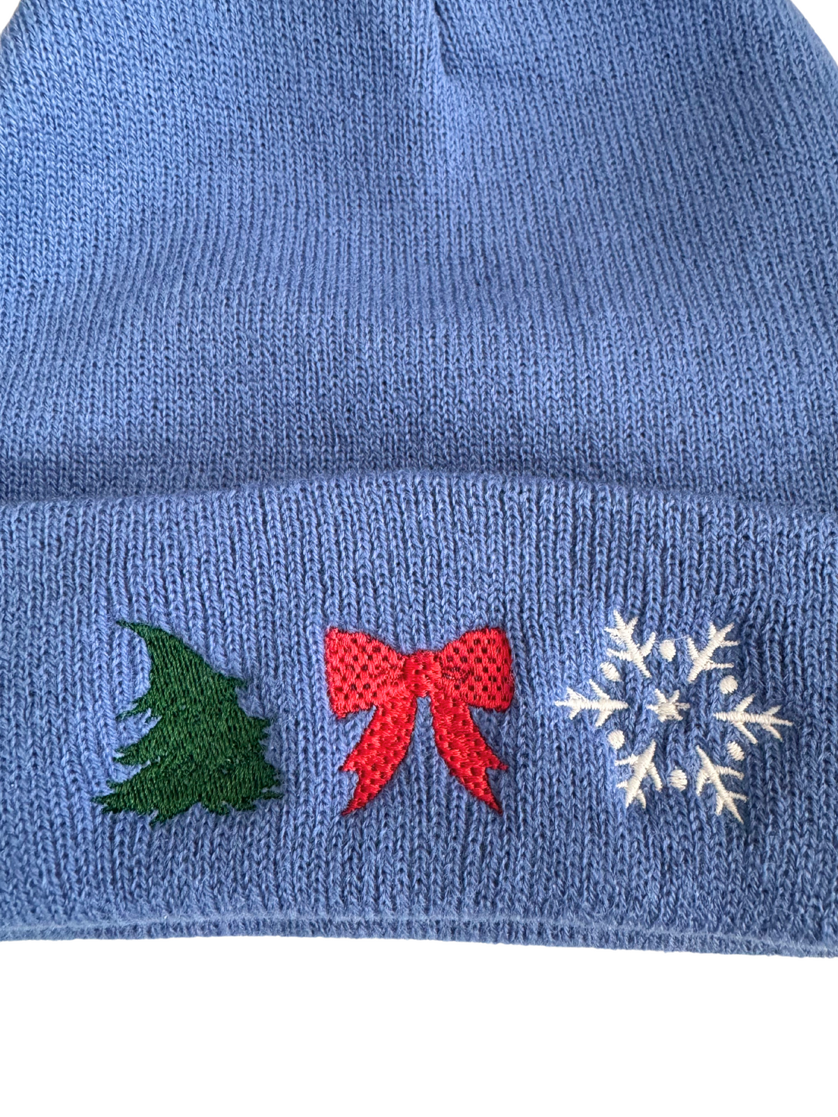Original detail view of blue holiday embroidered beanie
