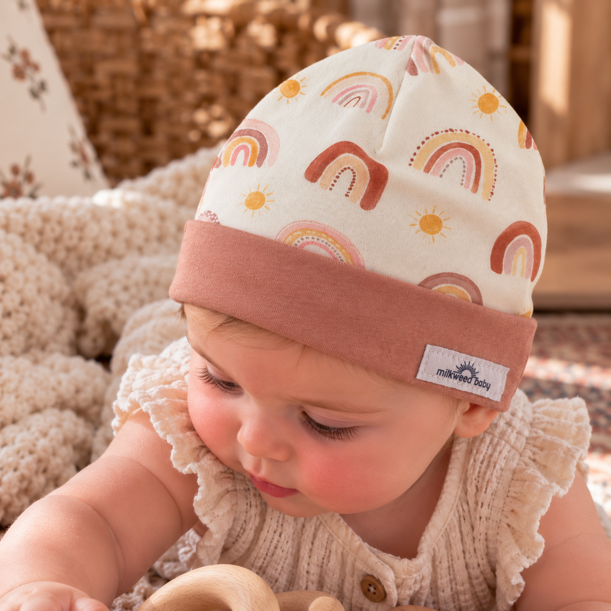 Baby wearing boho rainbow organic cotton beanie