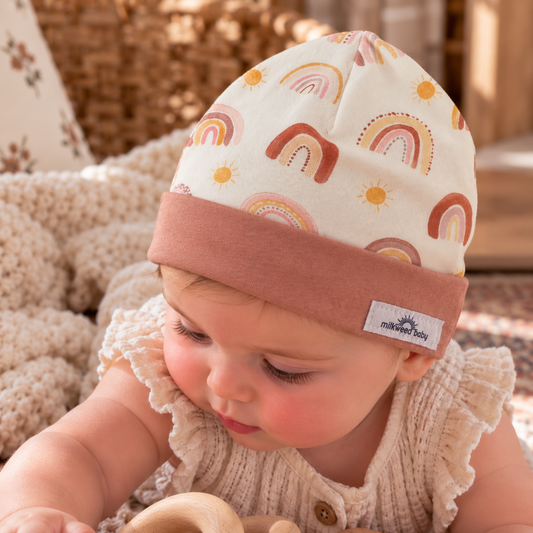 Baby wearing boho rainbow organic cotton beanie