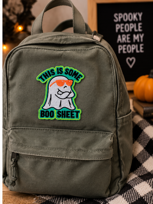 This Is Some Boo Sheet embroidered ghost patch styled on a canvas backpack