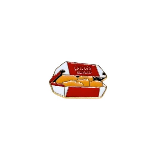 Enamel pin shaped like a chicken nuggets box on white background