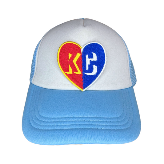Patch ironed onto a white and blue trucker hat