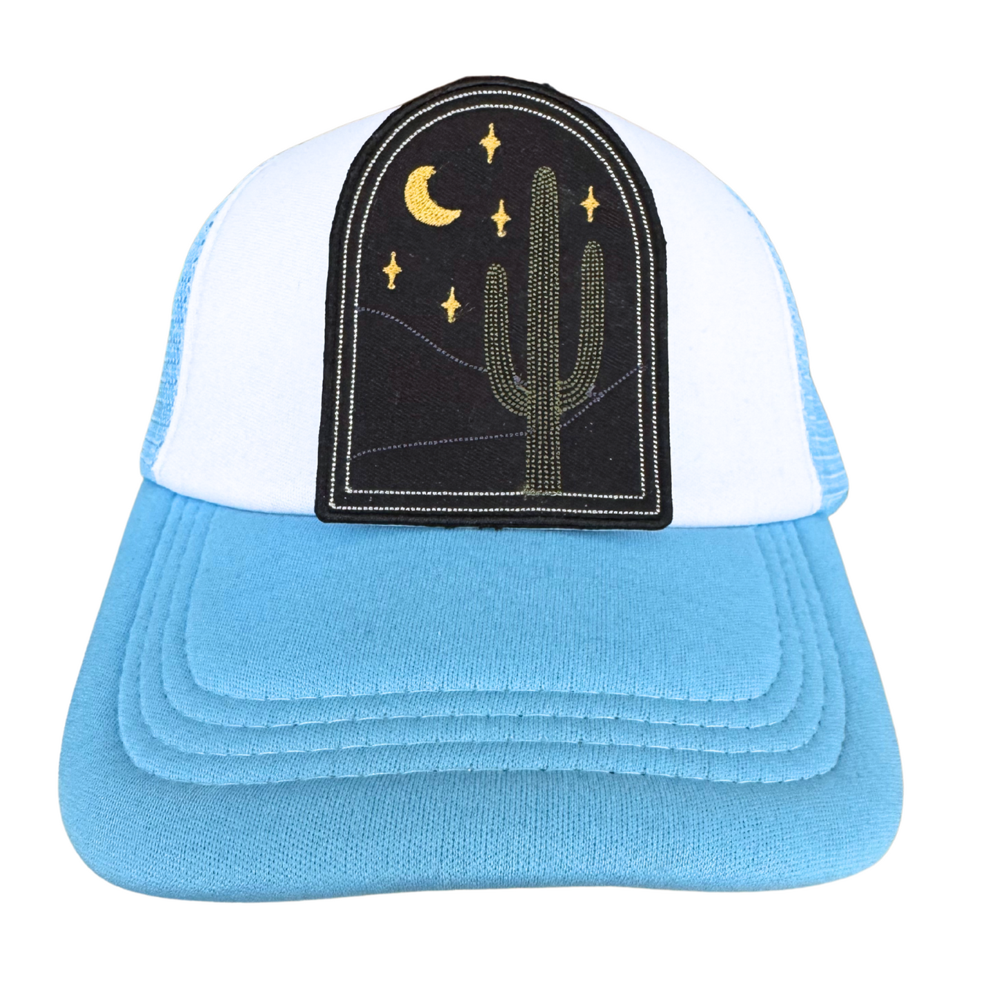 Trucker hat featuring cactus and moon embroidered patch with desert night scene