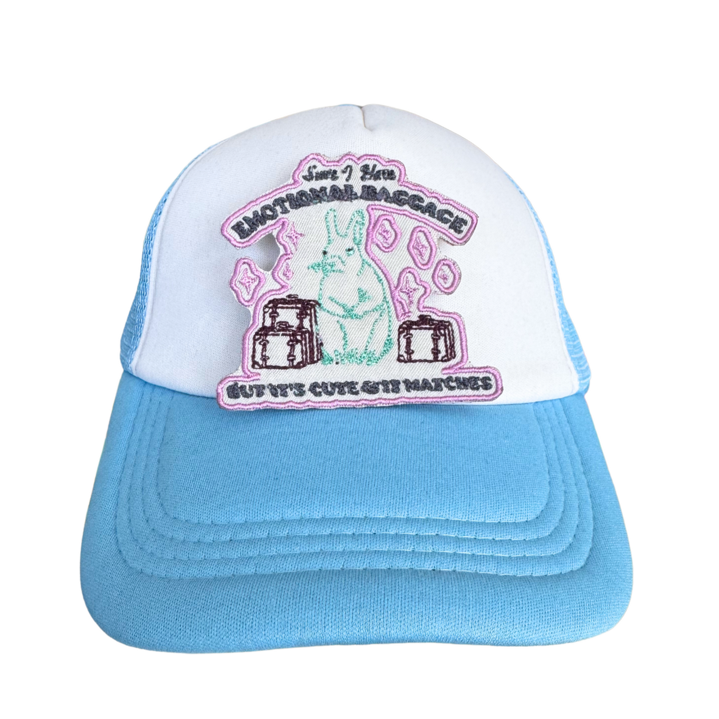 Trucker hat featuring the "Sure, I Have Emotional Baggage, But It’s Cute and It Matches" patch with a bunny and luggage design.