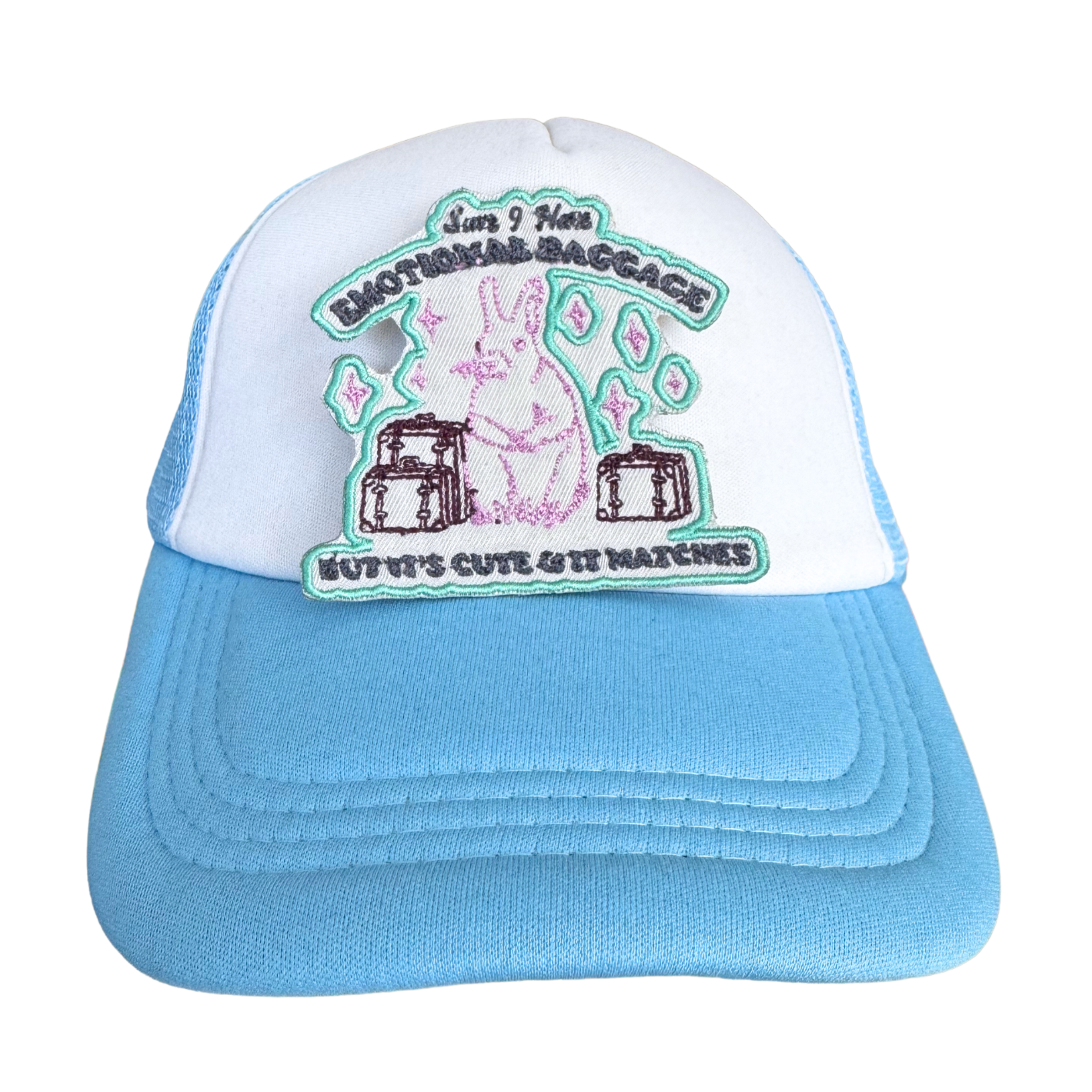 Iron-on embroidered patch attached to a blue-and-white trucker hat.