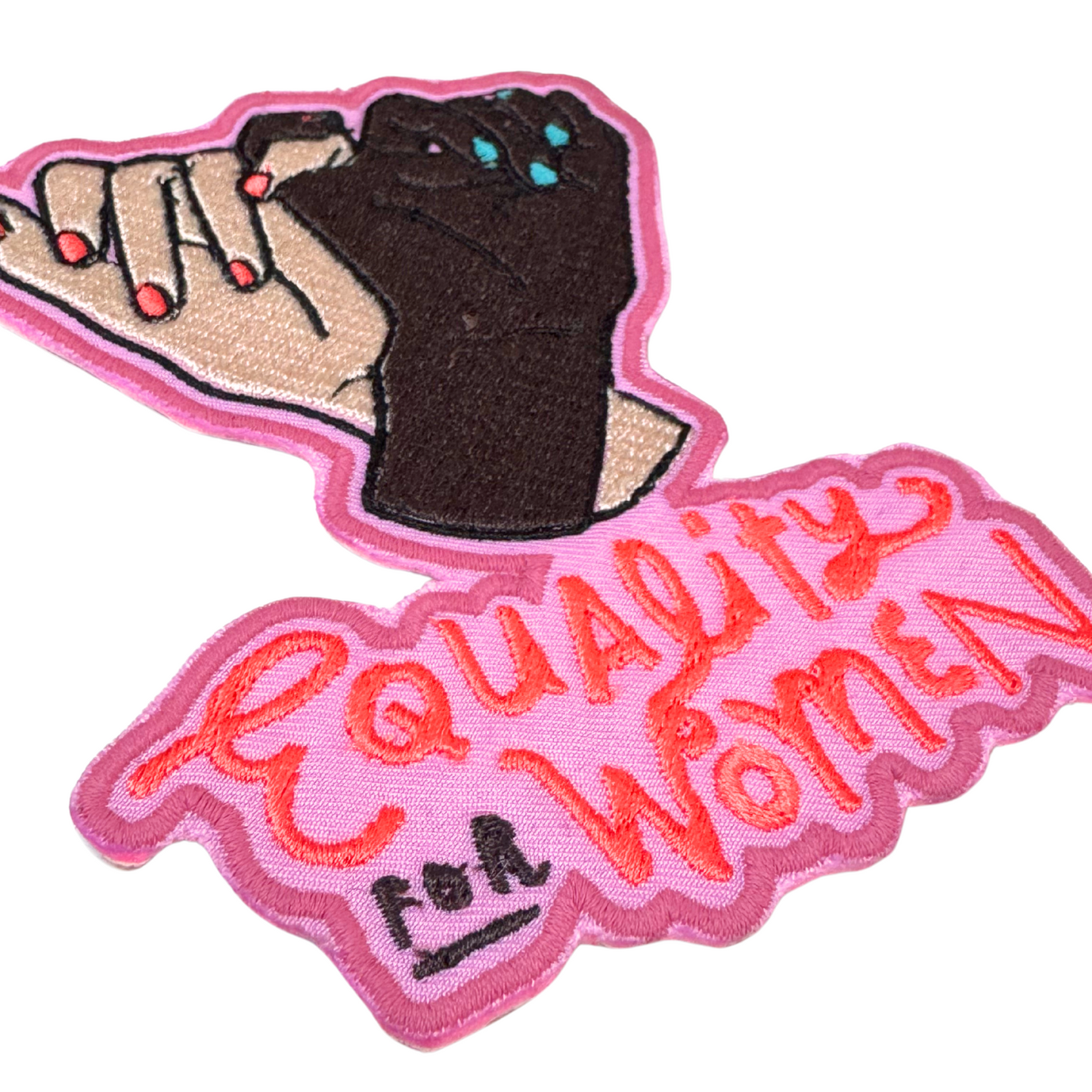 Side angle close-up of Equality for Women patch with pink background and embroidery details