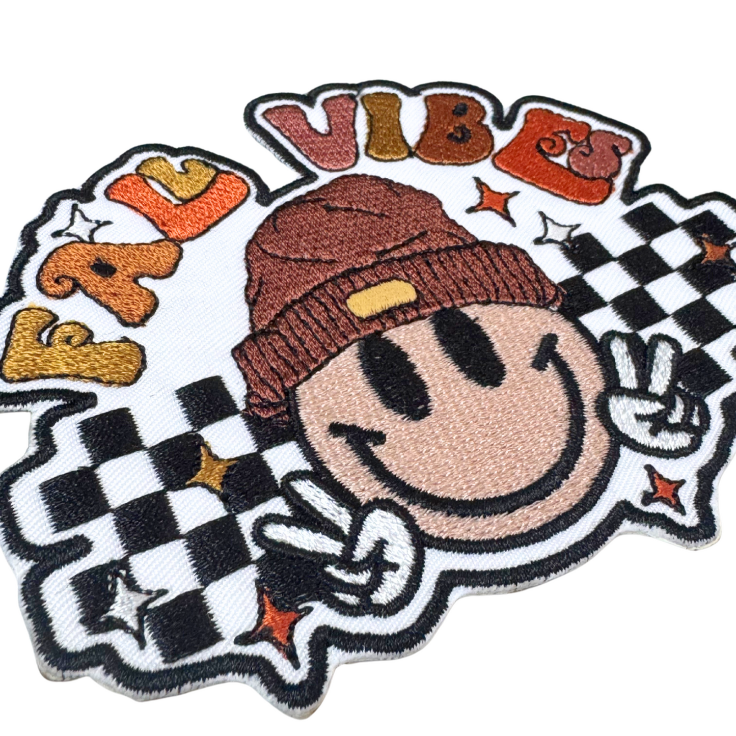 “Close-up side angle of Fall Vibes embroidered patch showing texture and details”