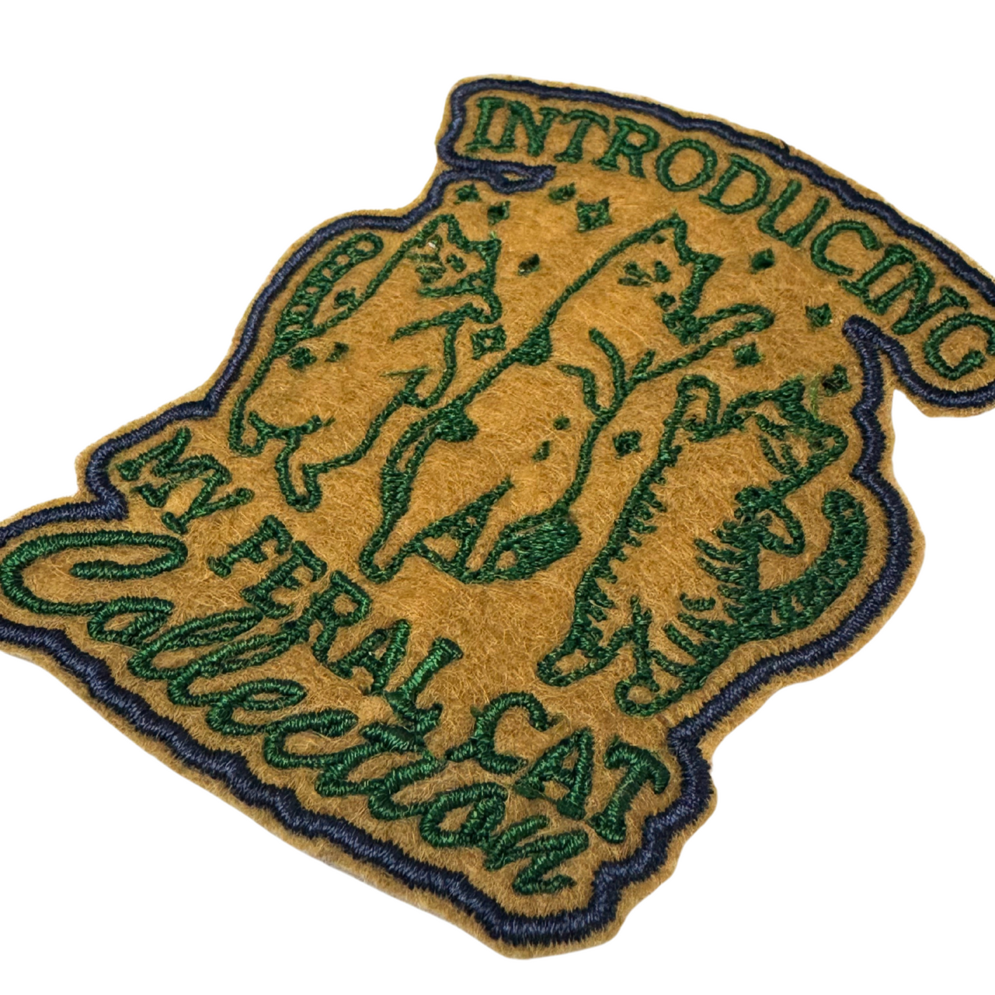 Close-up angled view of Introducing My Feral Cat Collection funny embroidered patch