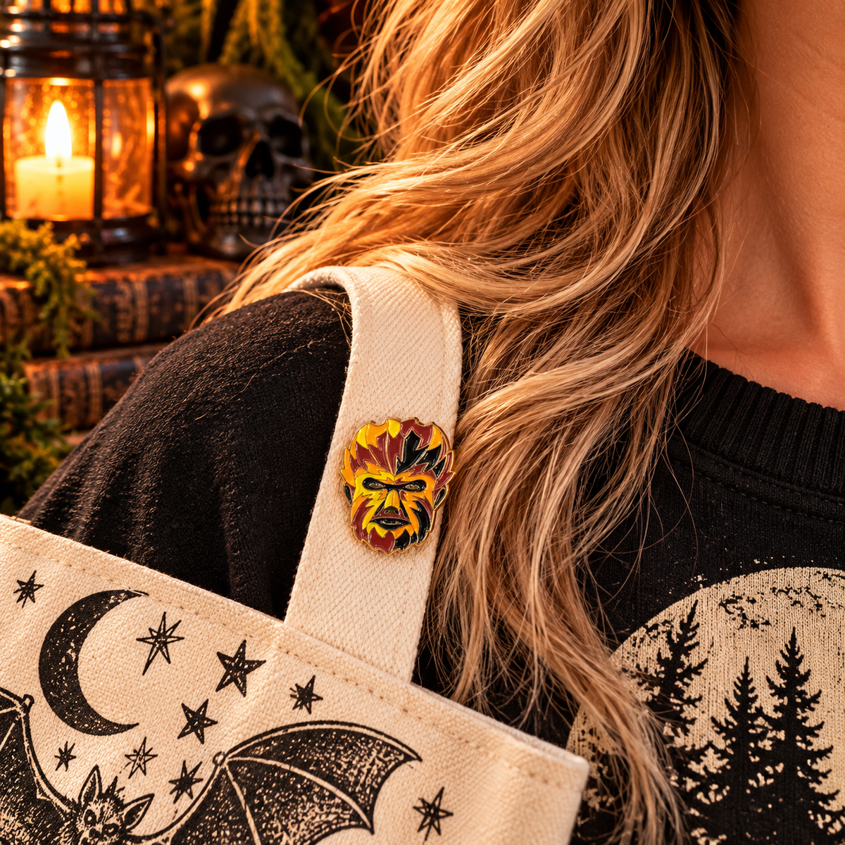 Petite fiery werewolf enamel pin worn on a canvas tote strap