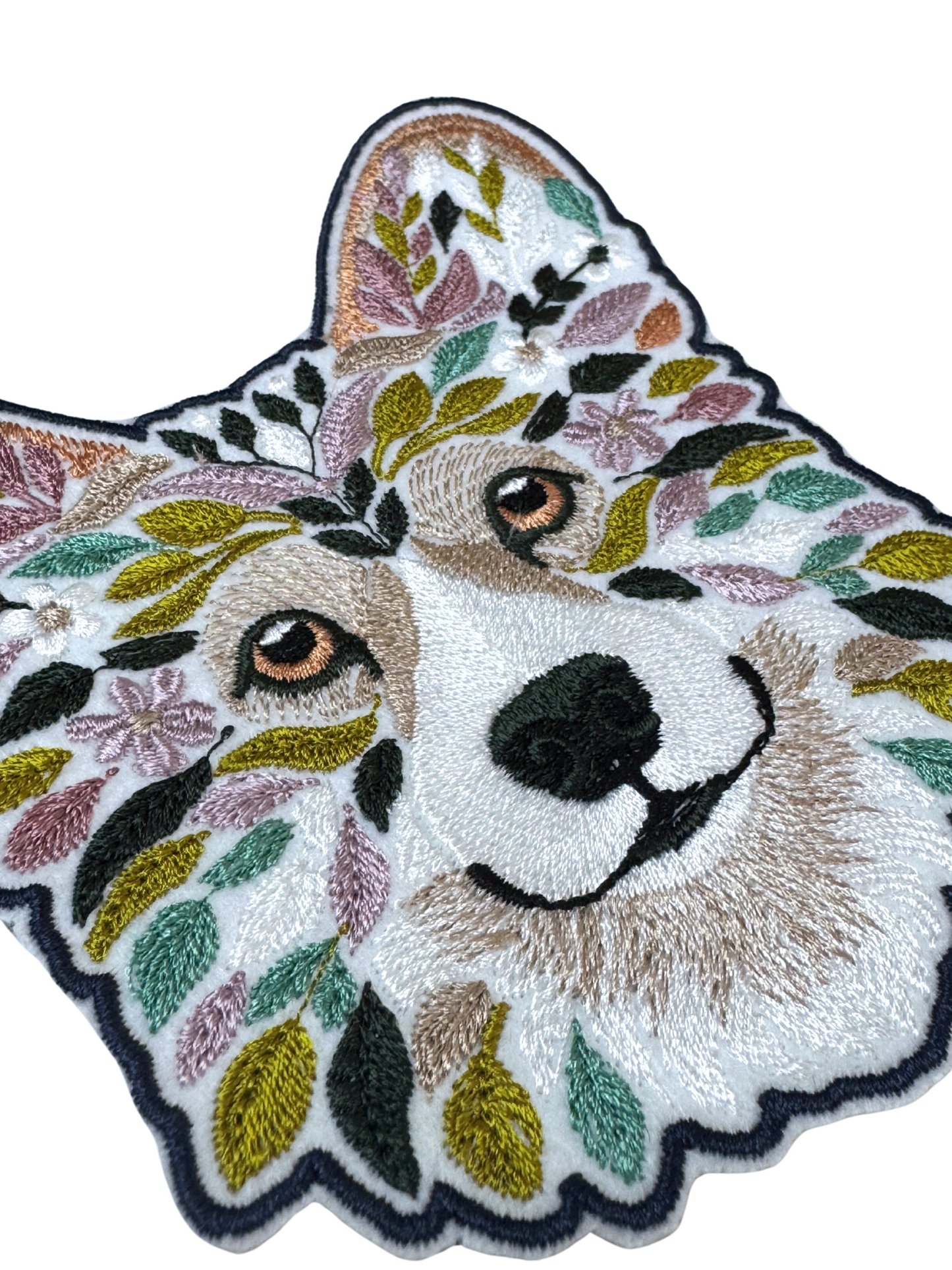 Close-up detail of floral corgi embroidery patch