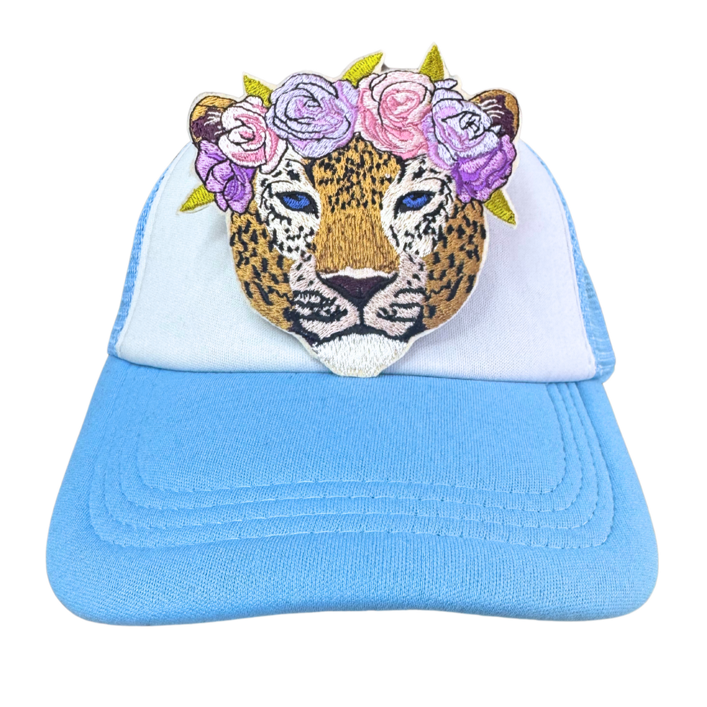 Floral Crown Leopard embroidered patch applied to a light blue trucker hat.