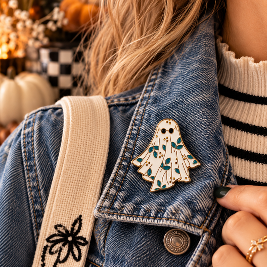 Floral ghost enamel pin styled on a denim jacket lifestyle image