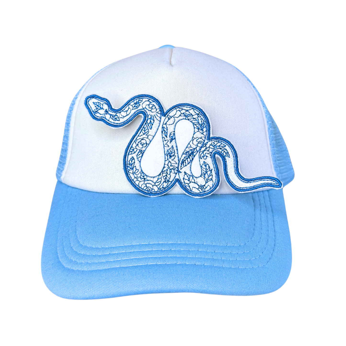 Blue floral snake embroidered patch attached to a light blue and white trucker hat.