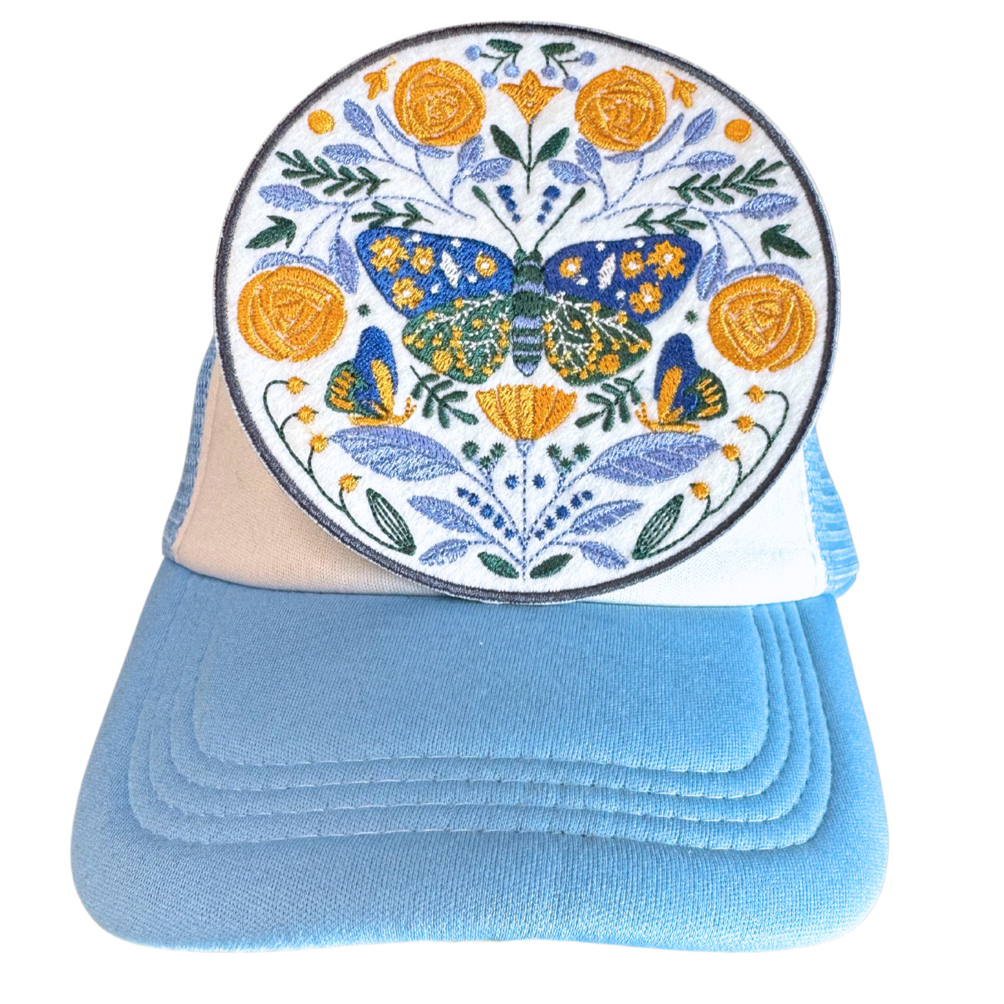 folk butterfly patch on light blue and white trucker hat
